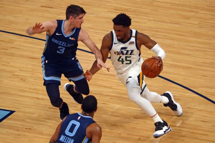 Donovan Mitchell (45) drives past Grayson Allen (3) for an easy bucket